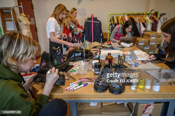 Designer Emma Gage of fashion label Melke checks a creation during a fitting ahead of her New York Fasion Week runway show, in New York on February...