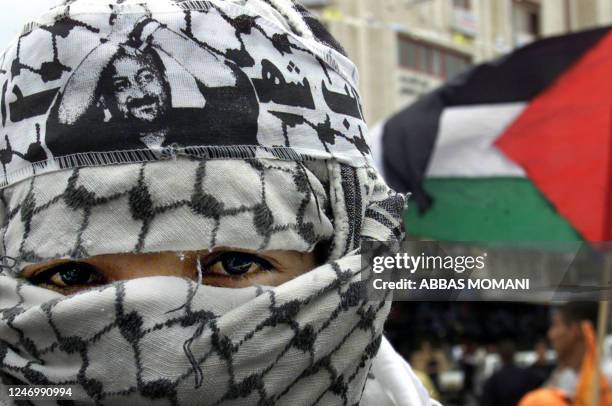 Palestinian demonstrator takes part in a protest in support of Palestinian member of the Fatah movement Marwan Barghuti in the West Bank city of...