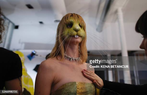 Model gets ready backstage for the Collina Strada show during York Fasion Week in New York on February 10, 2023. - New York Fashion Week kicks off...