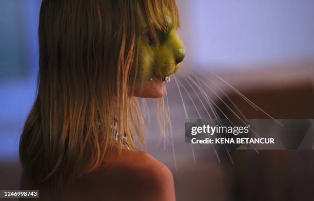 Model gets ready backstage for the Collina Strada show during York Fasion Week in New York on February 10, 2023. - New York Fashion Week kicks off...