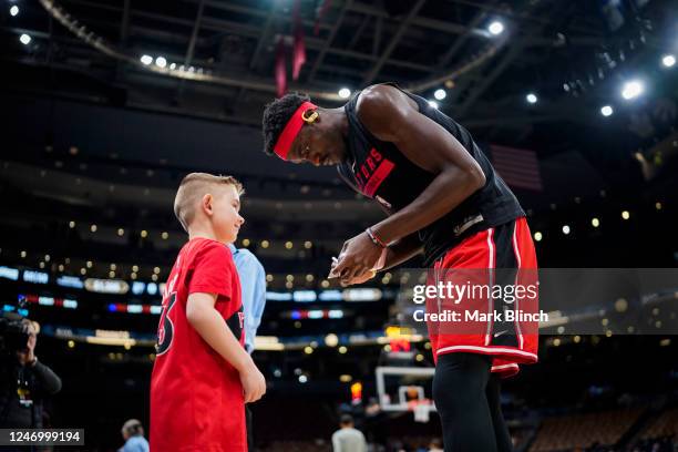 Pascal Siakam of the Toronto Raptors autographs his player card for a fan before the game against the Utah Jazz on February 10, 2023 at the...