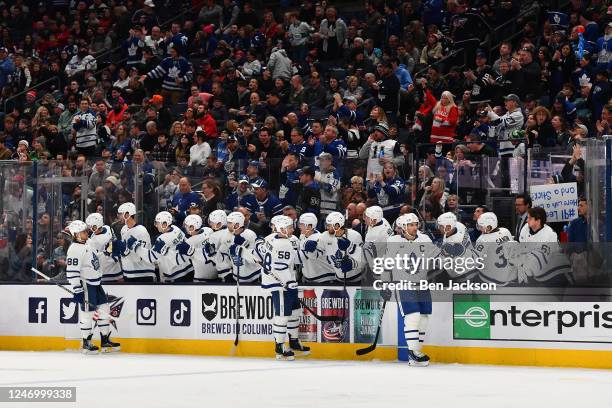 John Tavares of the Toronto Maple Leafs celebrates with teammates after scoring a goal during the first period of a game against the Columbus Blue...