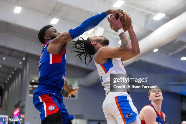 David Nwaba of the Motor City Cruise blocks a shot by Jaden Shackelford of the Oklahoma City Blue on February 10, 2023 at Wayne State Fieldhouse in...