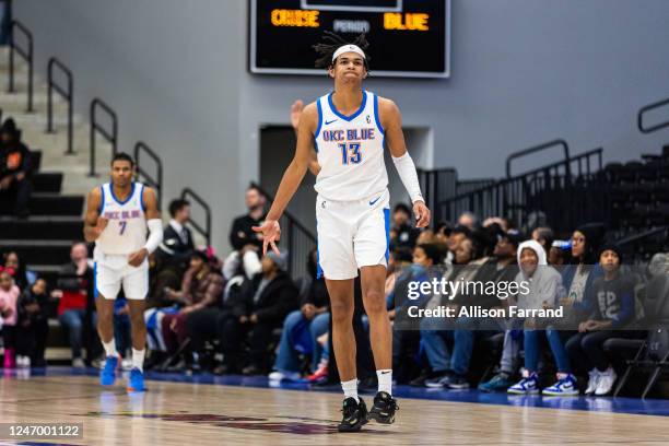 Ousmane Dieng of the Oklahoma City Blue celebrates a 3-pointer against the Motor City Cruise on February 10, 2023 at Wayne State Fieldhouse in...