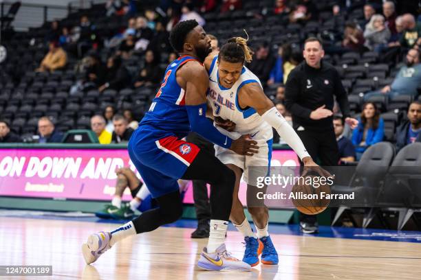 Jahmius Ramsey of the Oklahoma City Blue drives to the basket against David Nwaba of the Motor City Cruise on February 10, 2023 at Wayne State...