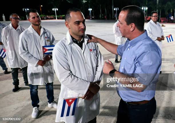 Cuban Health Minister José Ángel Portal greets doctors and nurses from Cuba's Henry Reeve International Medical Brigade before they leave to Turkey...