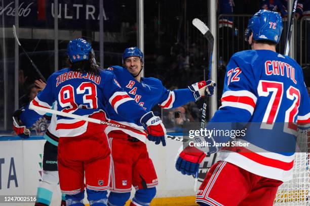 Mika Zibanejad and Chris Kreider of the New York Rangers celebrate after a goal in the third period against the Seattle Kraken at Madison Square...