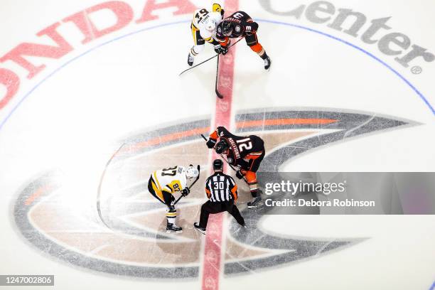 Sidney Crosby of the Pittsburgh Penguins and Isac Lundestrom of the Anaheim Ducks get ready for the face off during the first period at Honda Center...