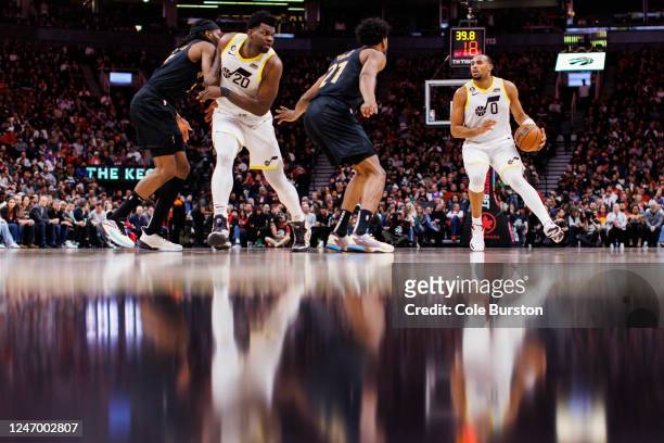 Talen Horton-Tucker of the Utah Jazz dribbles against Thaddeus Young of the Toronto Raptors during the second half of their NBA game at Scotiabank...