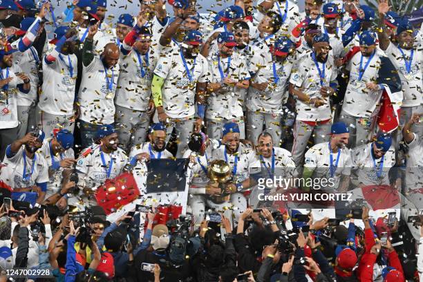 Dominican Republic's Tigres de Licey celebrate with the trophy after defeating Venezuela's Leones de Caracas during their final Caribbean Series...