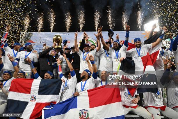 Dominican Republic's Tigres de Licey celebrate with the trophy after defeating Venezuela's Leones de Caracas during their final Caribbean Series...
