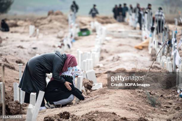 People mourn the death of their relatives following the earthquake. Monday morning, a strong earthquake of 7.7 magnitude, centered in the Pazarcik...