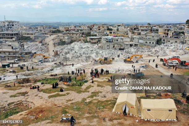 This aerial view shows tents set up as temporary shelters for people who have been left homeless as search and rescue operations continue amidst the...