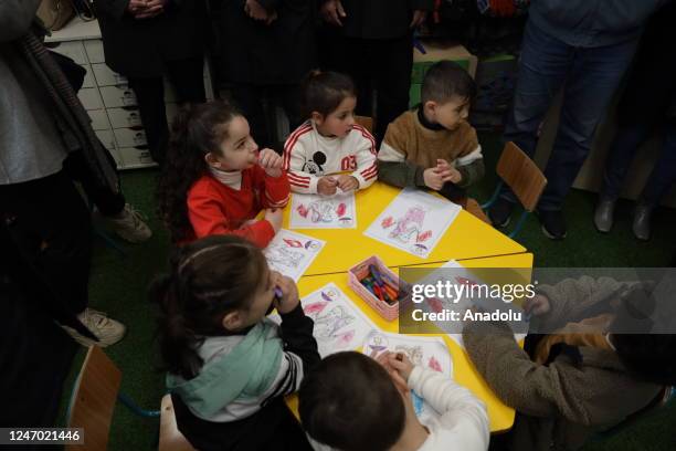 Palestinian pre-schoolers paint for earthquake victims after 7.7 and 7.6 magnitude earthquakes hit southern Turkiye and northern Syria, in Jerusalem...