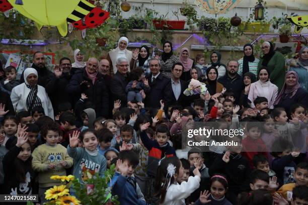 Turkish Consul General in Jerusalem Ahmet Riza Demirer attends the event as Palestinian pre-schoolers paint for earthquake victims after 7.7 and 7.6...