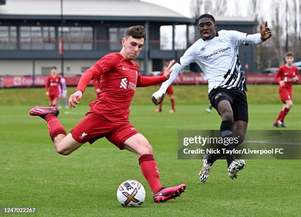 Josh Davidson of Liverpool and Cameron Ashia of Derby County in action at the Axa Training Centre on February 11, 2023 in Liverpool, England.