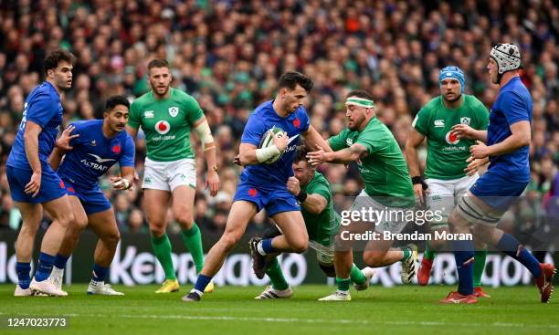 Dublin , Ireland - 11 February 2023; Ethan Dumortier of France is tackled by Peter OMahony, right, and Rob Herring of Ireland during the Guinness Six...