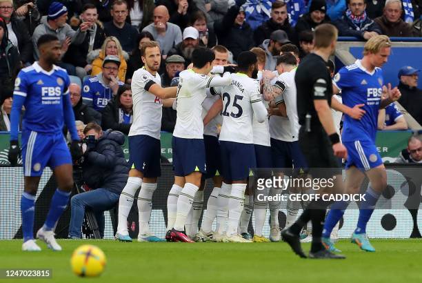Tottenham Hotspur's Uruguayan midfielder Rodrigo Bentancur is mobbed by teammates after scoring the opening goal during the English Premier League...