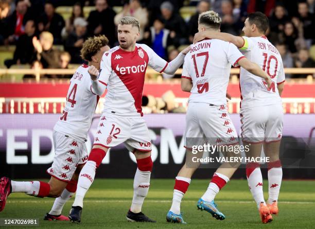 Monaco's Russian midfielder Aleksandr Golovin is congratulated by team mates Monaco's French forward Wissam Ben Yedder , Monaco's Brazilian...