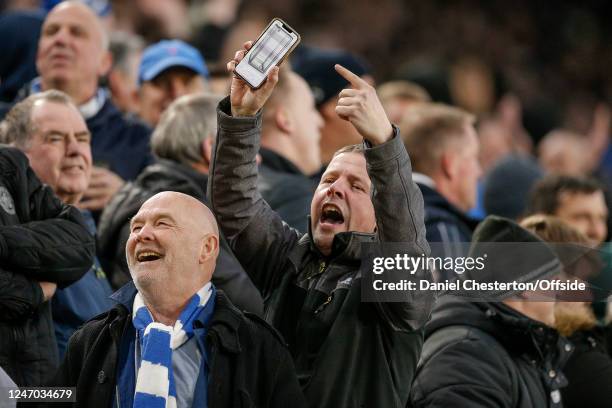 Leicester fan taunts Tottenham Hotspur fans with a photo of an empty cabinet during the Premier League match between Leicester City and Tottenham...