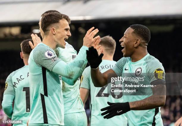 Brighton & Hove Albion's Solly March celebrates scoring his side's first goal with team mate Pervis Estupinan during the Premier League match between...