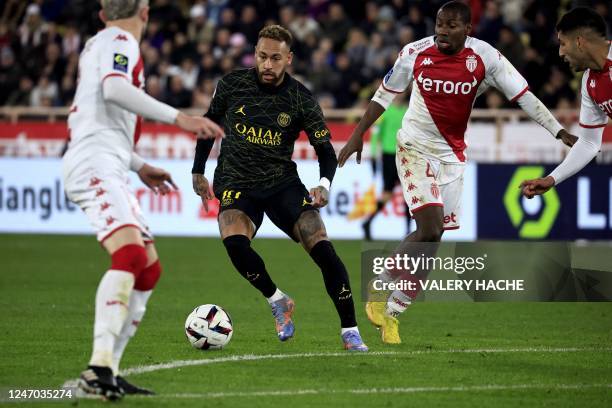 Paris Saint-Germain's Brazilian forward Neymar dribbles during the French L1 football match between Monaco and Paris Saint-Germain at the Louis II...