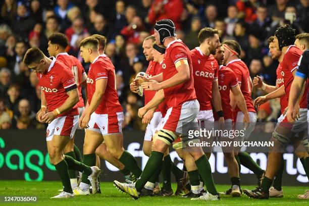 Wales players celebrate their first try during the Six Nations international rugby union match between Scotland and Wales at Murrayfield Stadium in...