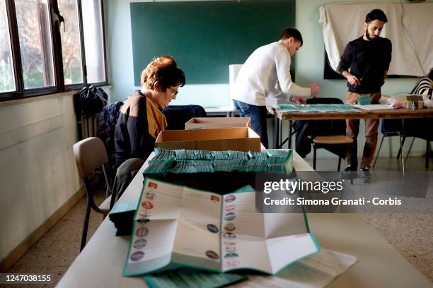 Tellers prepare the voting operations in a polling station with the signing and stamping of ballots for the renewal of the office of President of the...