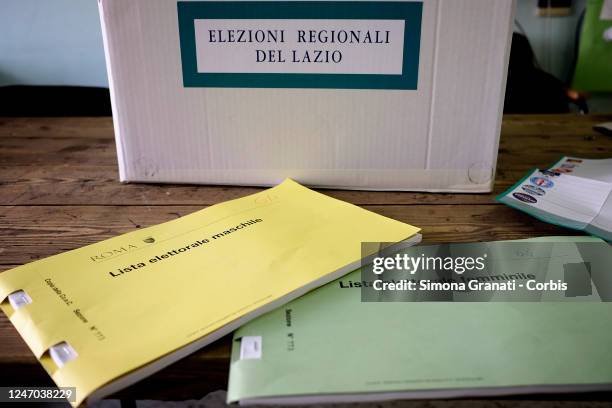 The electoral lists in a polling station,in green for women and yellow for men instead of the pink and blue of previous years. Last year there were...