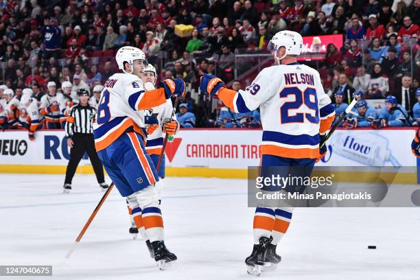 Brock Nelson of the New York Islanders celebrates his goal with teammate Noah Dobson during the first period against the Montreal Canadiens at Centre...