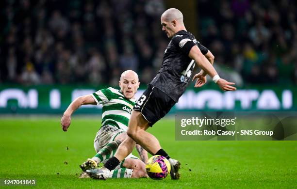 Celtic's Aaron Mooy tackles St Mirren's Alex Gogic during a Scottish Cup match between Celtic and St Mirren at Celtic Park, on February 11 in...