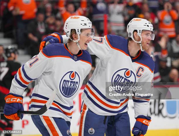 Ryan McLeod of the Edmonton Oilers celebrates his second period short handed goal against the Ottawa Senators with teammate Connor McDavid at...