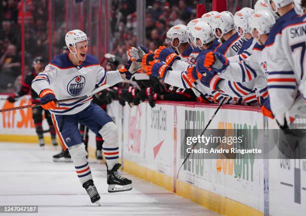 Jesse Puljujarvi of the Edmonton Oilers celebrates his third period goal against the Ottawa Senators with teammates at the players bench at Canadian...