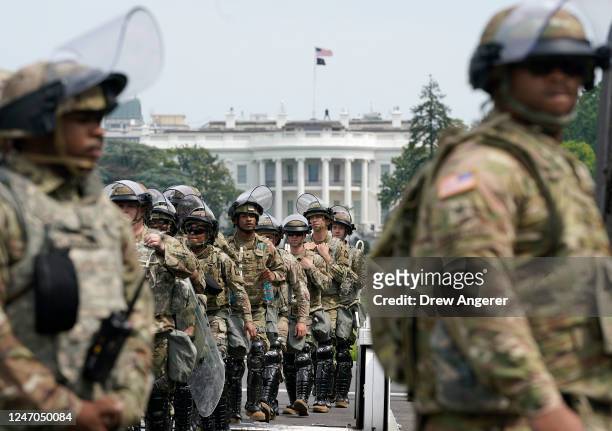 National Guard members deploy near the White House as peaceful protests are scheduled against police brutality and the death of George Floyd, on June...