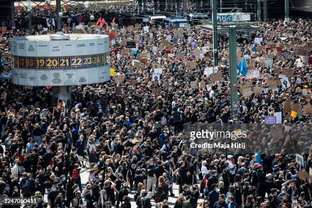 People protest against racism and police brutality on June 06, 2020 in Alexanderplatz in Berlin, Germany. Over 10,000 people attended a demonstration...