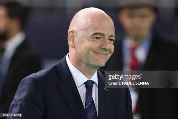 President Gianni Infantino arrives on the pitch at the end of during the FIFA Club World Cup final football match between Spain's Real Madrid and...