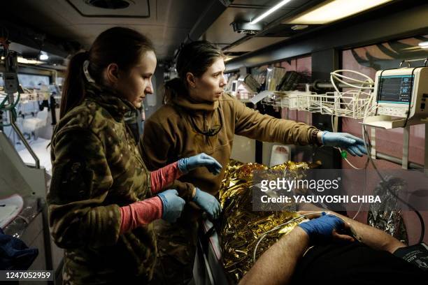 Mariia Danchyna and Anna Skolbushevska work as a paramedic of the volunteer medical battalion Hospitallers, which helps with medical evacuations of...