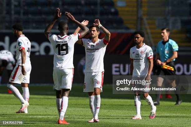 Moussa Niakhate and Danny Latza of 1. FSV Mainz 05 celebrate following their sides victory during the Bundesliga match between Eintracht Frankfurt...