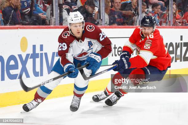 Aleksander Barkov of the Florida Panthers pursues Nathan MacKinnon of the Colorado Avalanche as he clears the puck from behind the net during first...