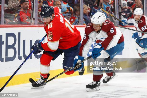 Erik Johnson of the Colorado Avalanche and Aleksander Barkov of the Florida Panthers chase a loose puck into the corner during first period action at...