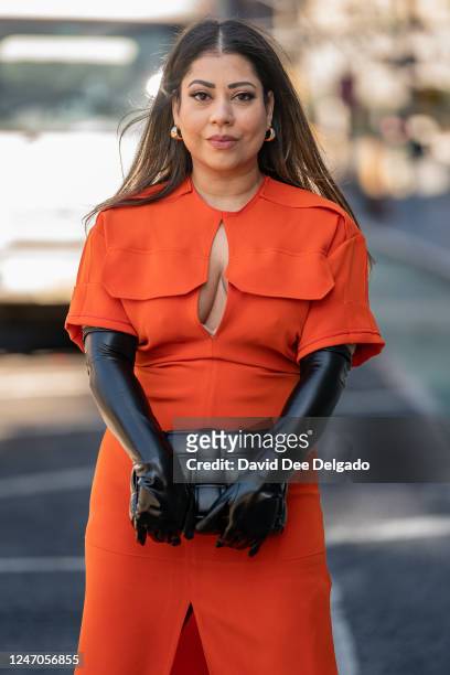 Asima Khan is seen wearing a dress by Victoria Beckham, gloves by Cynthia Rowley and boots by Schutz at Spring Studios during New York Fashion Week...