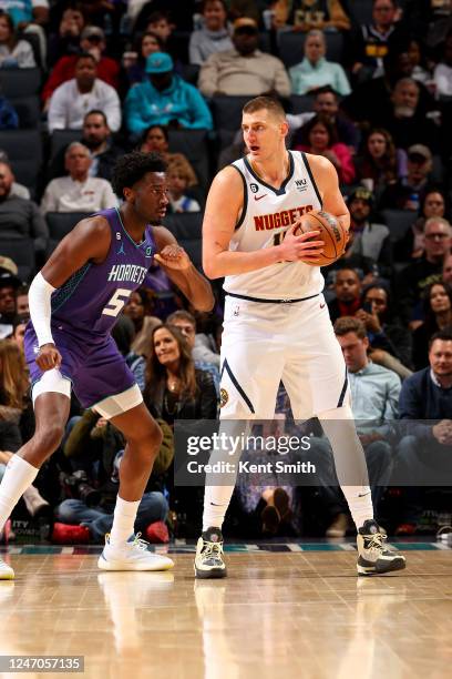 Nikola Jokic of the Denver Nuggets handles the ball during the game against the Charlotte Hornets on February 11, 2023 at Spectrum Center in...