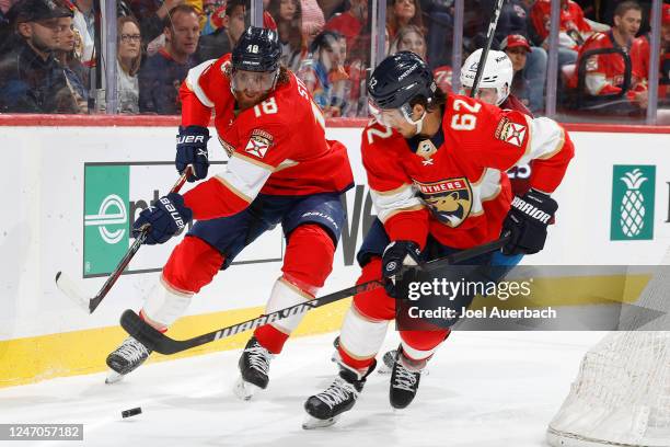 Marc Staal and Brandon Montour of the Florida Panthers clear the puck from behind the net against the Colorado Avalanche during second period action...
