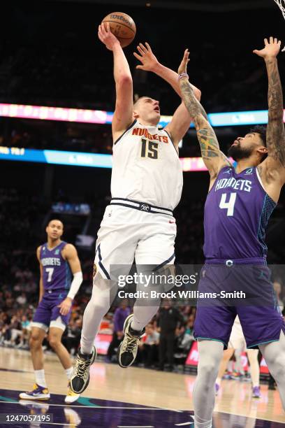 Nikola Jokic of the Denver Nuggets drives to the basket during the game against the Charlotte Hornets on February 11, 2023 at Spectrum Center in...