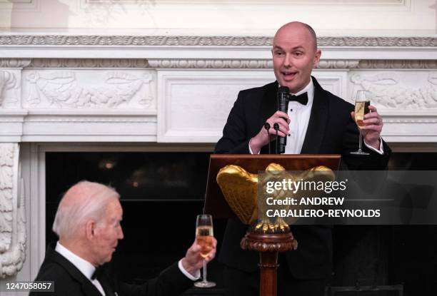 President Joe Biden toasts with Governor of Utah, Spencer Cox, as he gives a toast during a welcome black-tie dinner for Governors and their spouses...