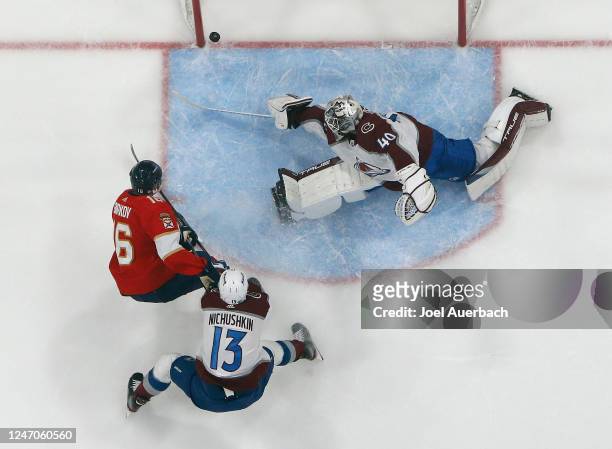 Valeri Nichushkin of the Colorado Avalanche follows the play as Aleksander Barkov of the Florida Panthers scores a third period goal past goaltender...