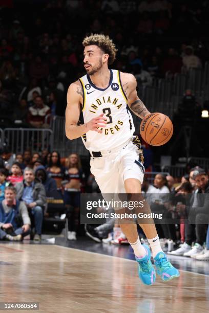 Chris Duarte of the Indiana Pacers dribbles the ball up the court during the game against the Washington Wizards on February 11, 2023 at Capital One...