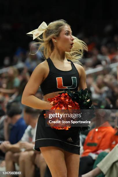 Miami Hurricanes cheerleader leaves the floor after performing during the game between the Louisville Cardinals and the Miami Hurricanes on Saturday,...