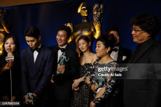 January 19, 2020: The Parasite cast, Woo-sik Choi, Sun-kyun Lee, So-dam Park, Jeong-eun Lee, Song Kang Ho and Bong Joon-Ho backstage at the 26th...