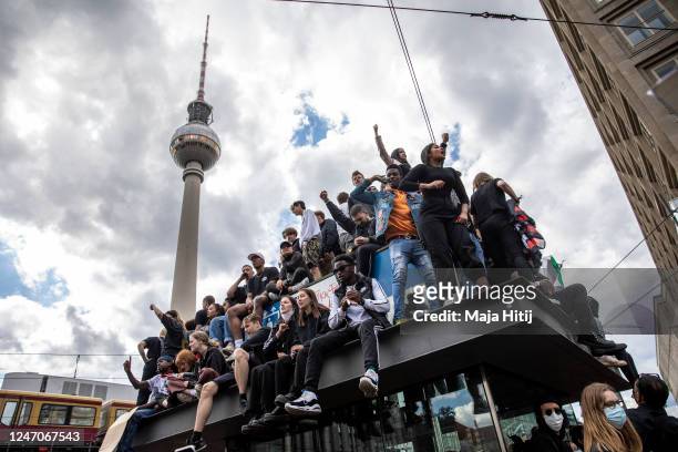 People stand during a protest against racism and police brutality on June 06, 2020 in Alexanderplatz in Berlin, Germany. Similar demonstrations have...